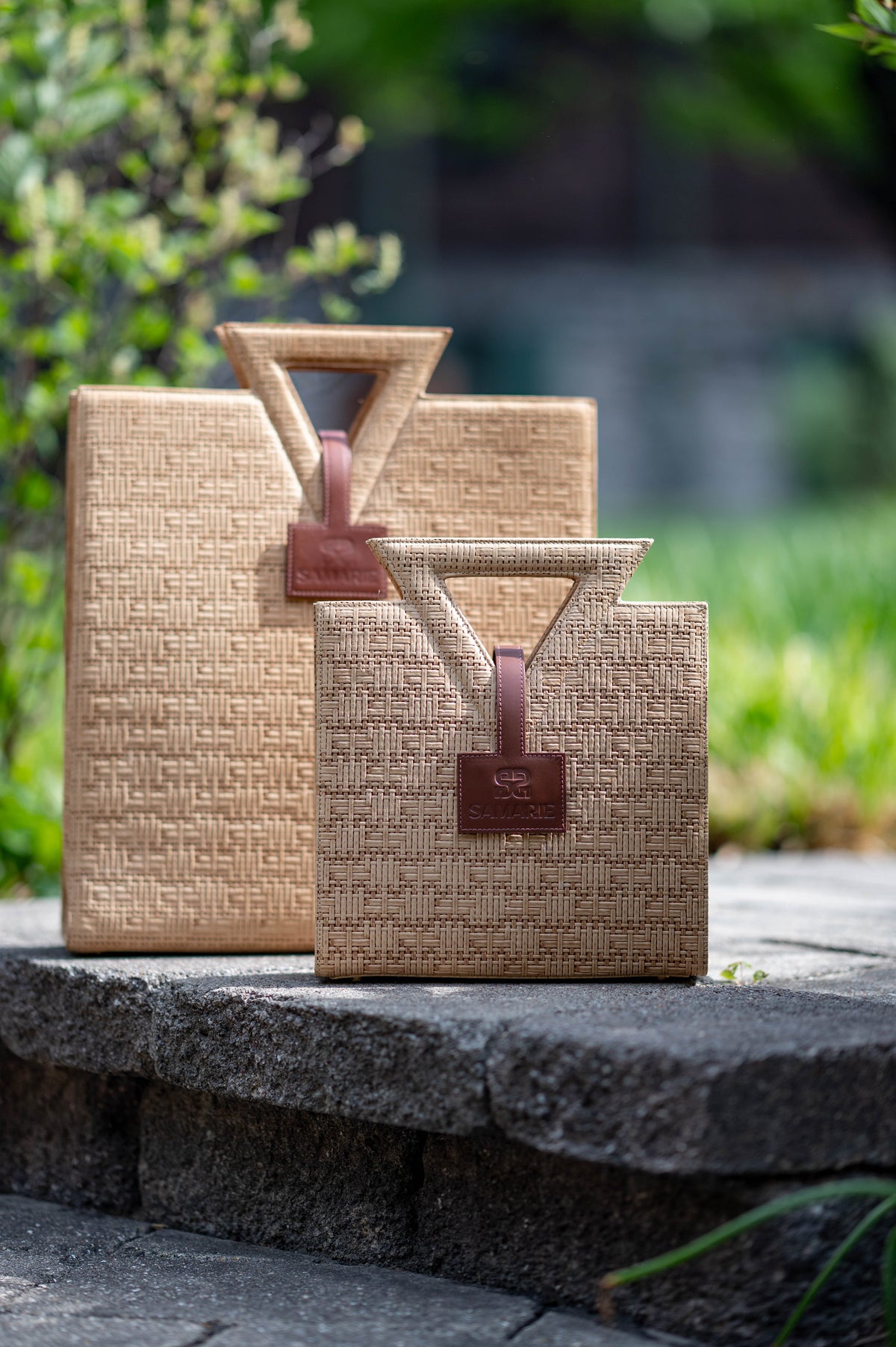 The Jane Tote and Jane Tote Mini with triangular handles and leather tabs