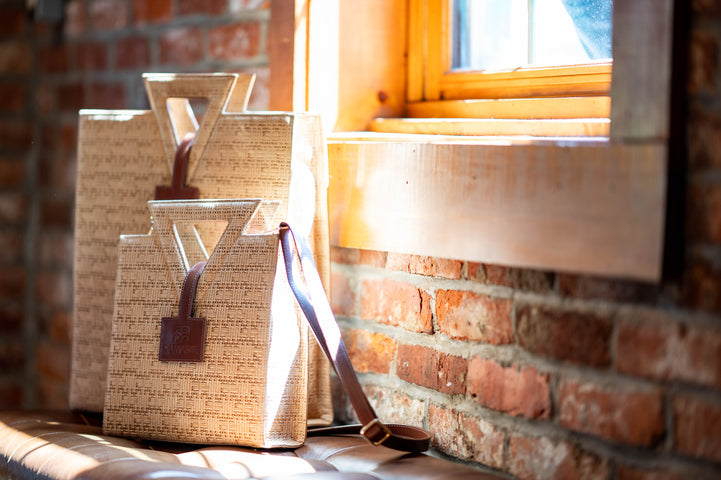 The Jane Tote and Mini with detachable strap in warm window light